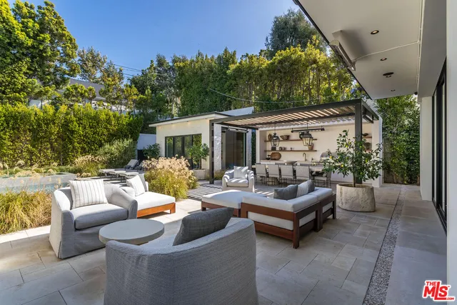a outdoor living space with furniture and garden view