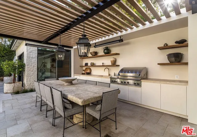 a kitchen with a table chairs and a stove