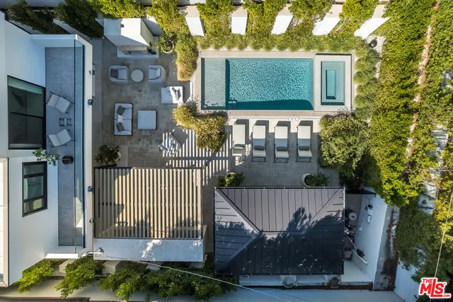 a view of a livingroom with furniture and a large window