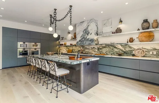 a kitchen with a table and chairs in it