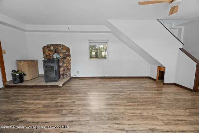a view of hallway with wooden floor