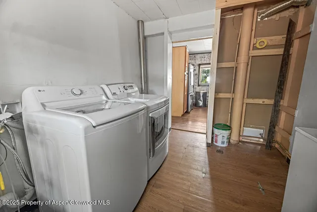 an empty room with windows and entrance