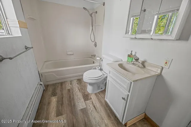 a view of a backyard with sitting area