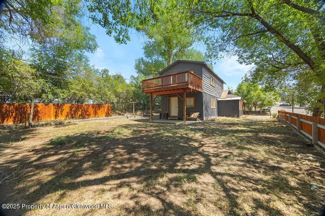 a kitchen with stainless steel appliances granite countertop a refrigerator and a stove