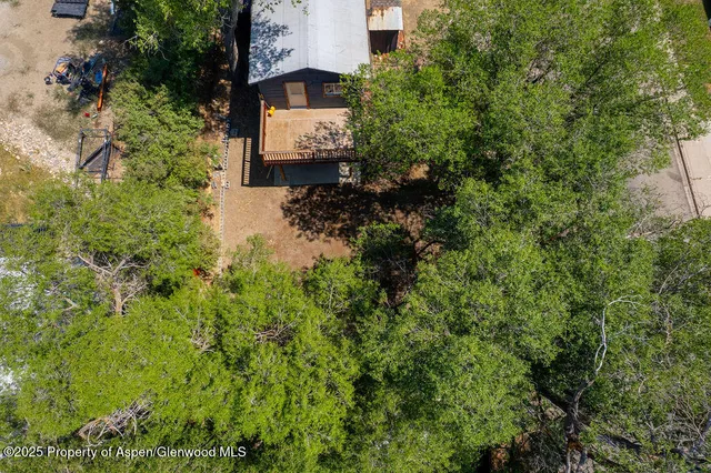 an aerial view of houses with yard
