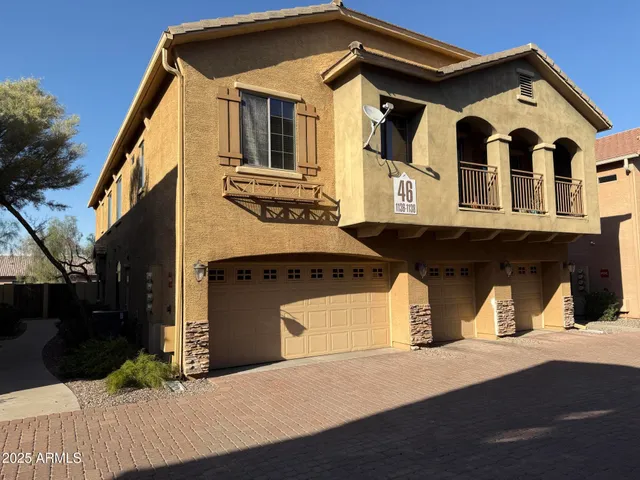 a front view of a house with a garage