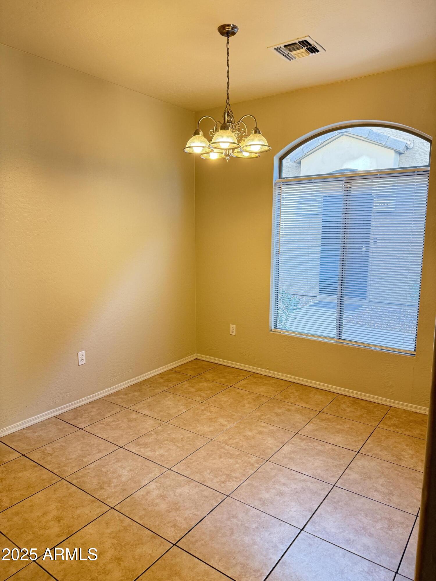 2150 East Bell Road, Unit 1138 Phoenix, AZ 85022 - Photo 14 of 38 a view of an empty room with a window