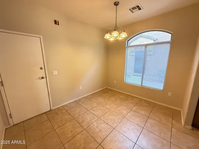 a view of a big room with windows