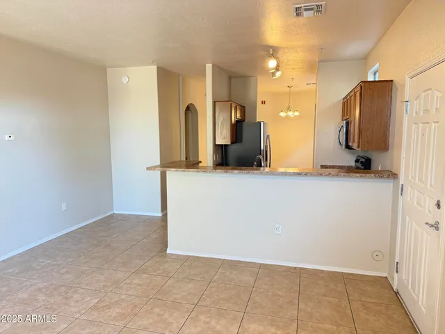 a view of a kitchen cabinets and a room