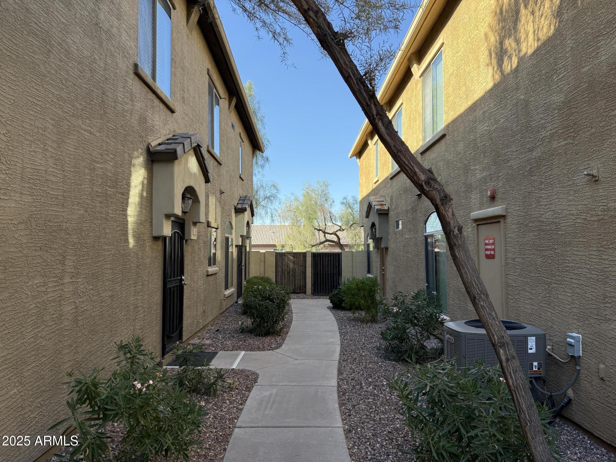 2150 East Bell Road, Unit 1138 Phoenix, AZ 85022 - Photo 2 of 38 a view of a potted plants in front of a building