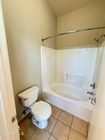 a bathroom with a toilet and a bathtub