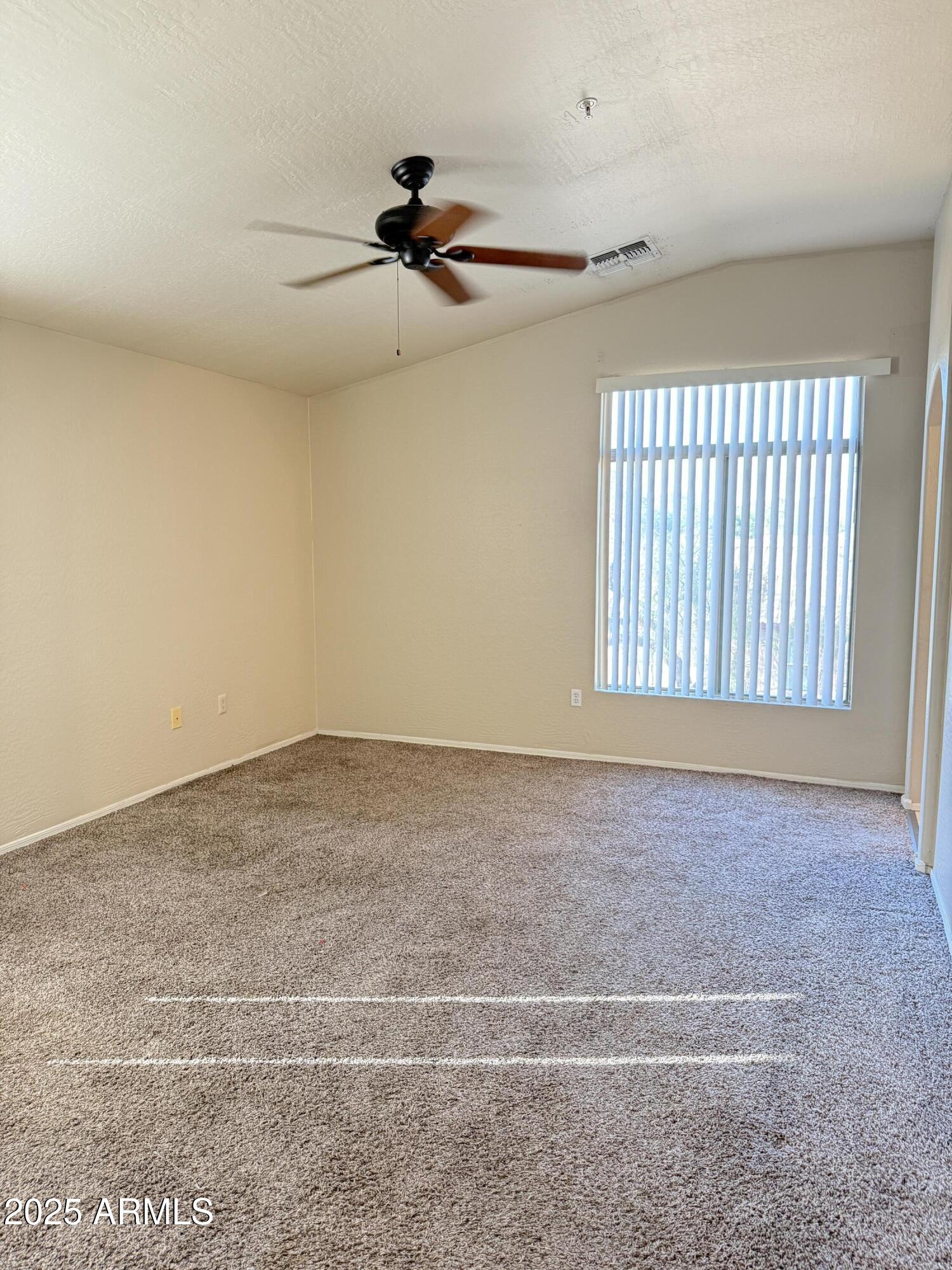 2150 East Bell Road, Unit 1138 Phoenix, AZ 85022 - Photo 24 of 38 a view of an empty room and a window