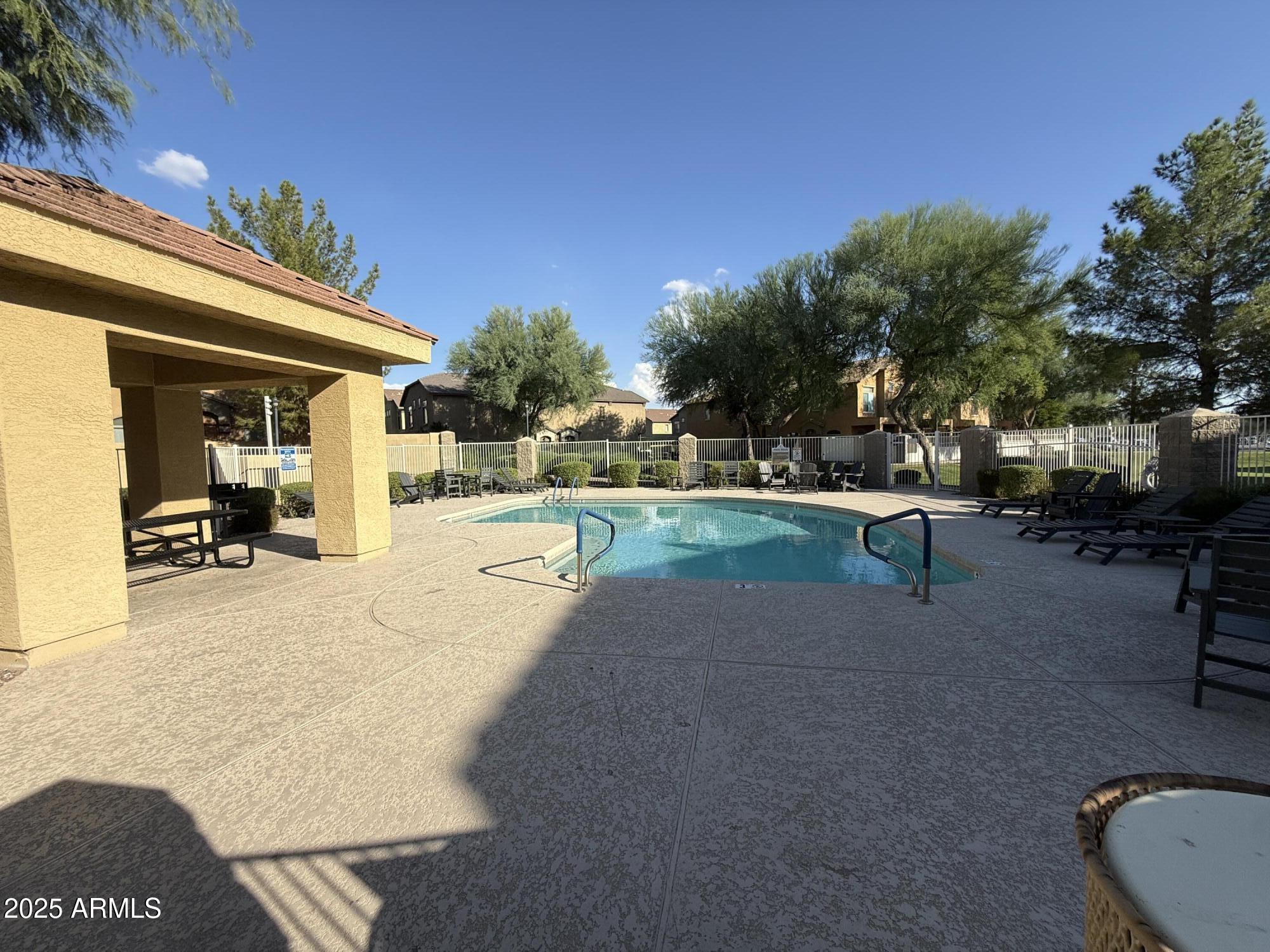 2150 East Bell Road, Unit 1138 Phoenix, AZ 85022 - Photo 36 of 38 a view of a backyard with a patio