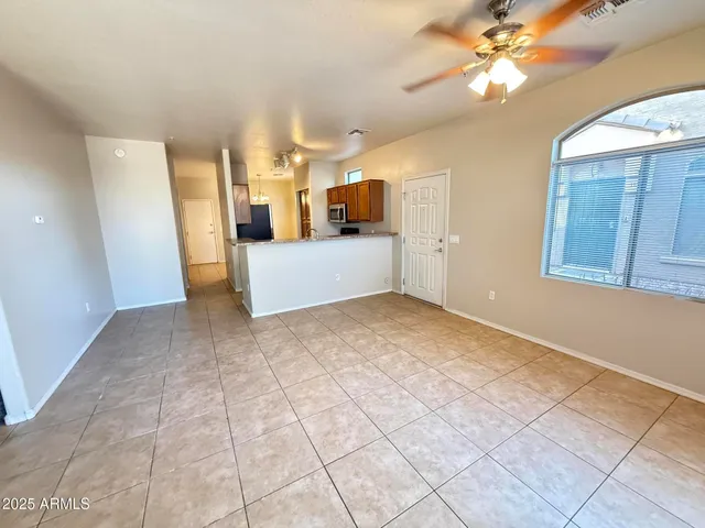 a view of a kitchen with a sink and a window