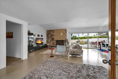 a bathroom with a sink a mirror and a window