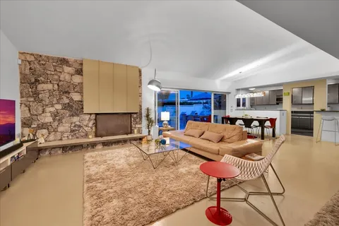 a view of a backyard with sitting area