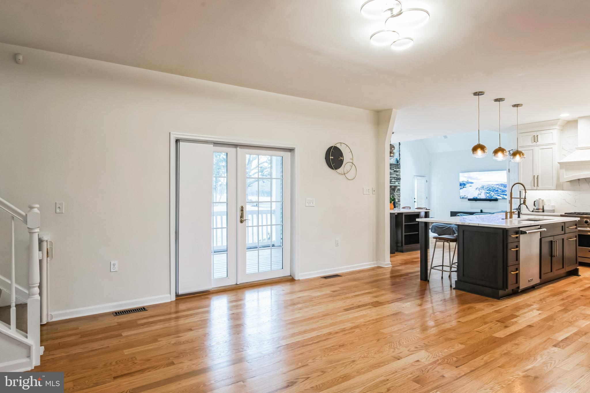 8419 Ingleton Road Easton, MD 21601 - Photo 11 of 58 a kitchen with granite countertop a stove top oven a sink and a refrigerator
