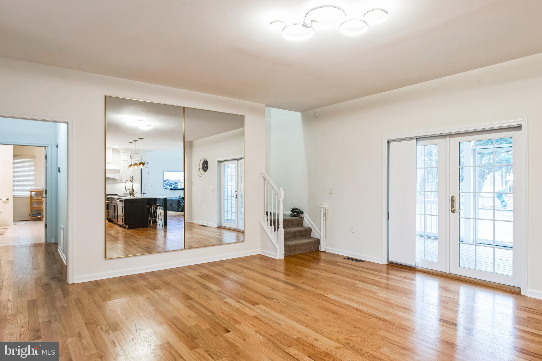 8419 Ingleton Road Easton, MD 21601 - Photo 13 of 58 a view of a big room with wooden floor and furniture