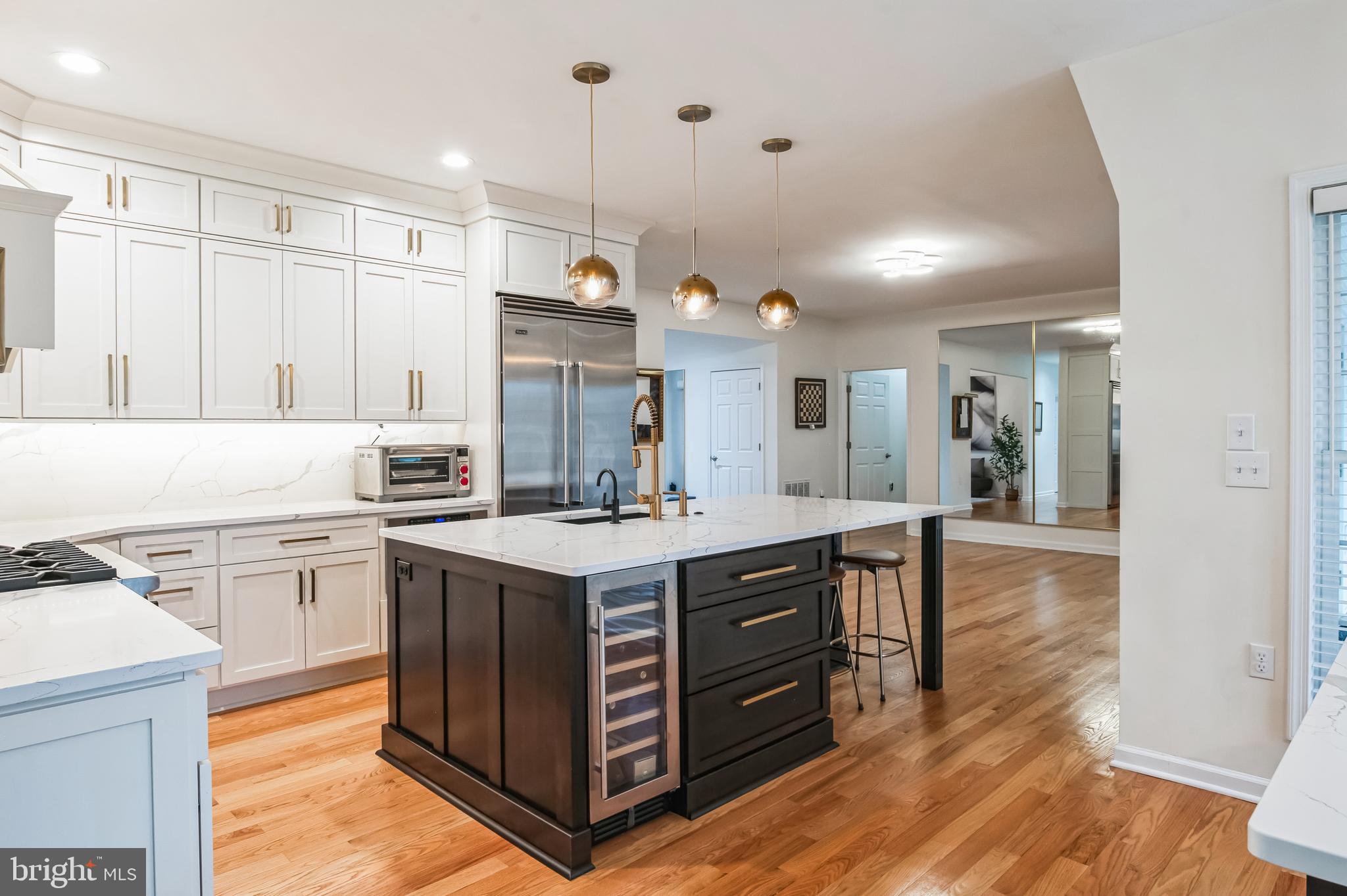8419 Ingleton Road Easton, MD 21601 - Photo 14 of 58 a kitchen with a sink stove and wooden cabinets