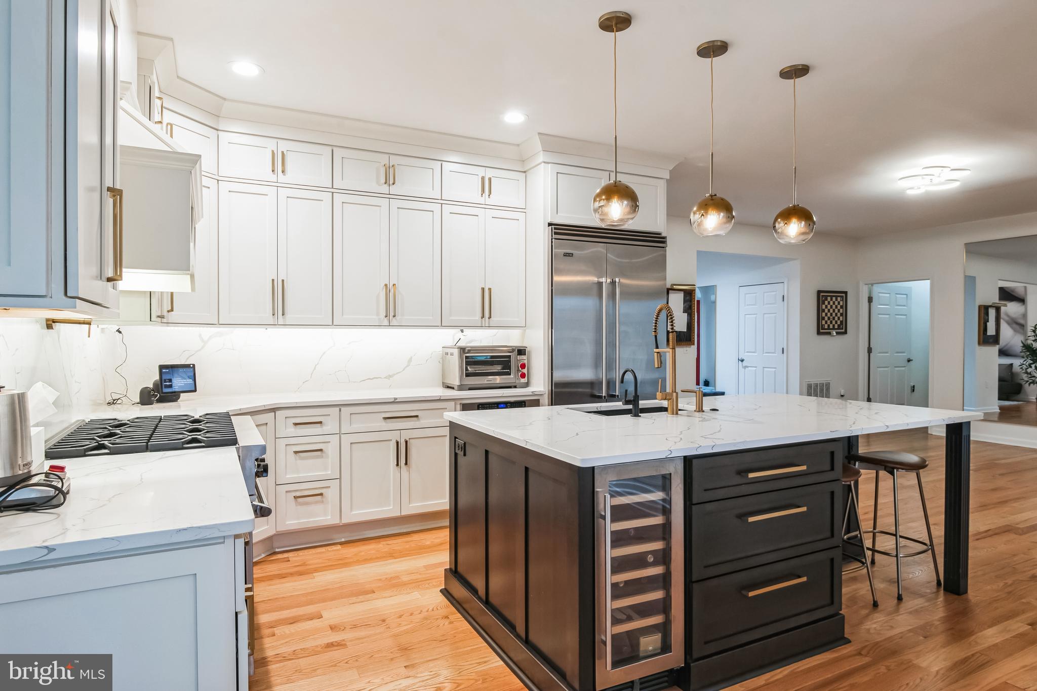 8419 Ingleton Road Easton, MD 21601 - Photo 16 of 58 a kitchen with a sink a counter space appliances and cabinets