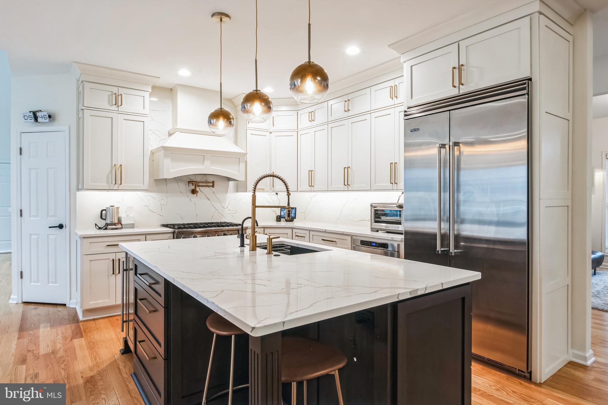 8419 Ingleton Road Easton, MD 21601 - Photo 17 of 58 a kitchen with kitchen island a counter space a sink appliances and cabinets