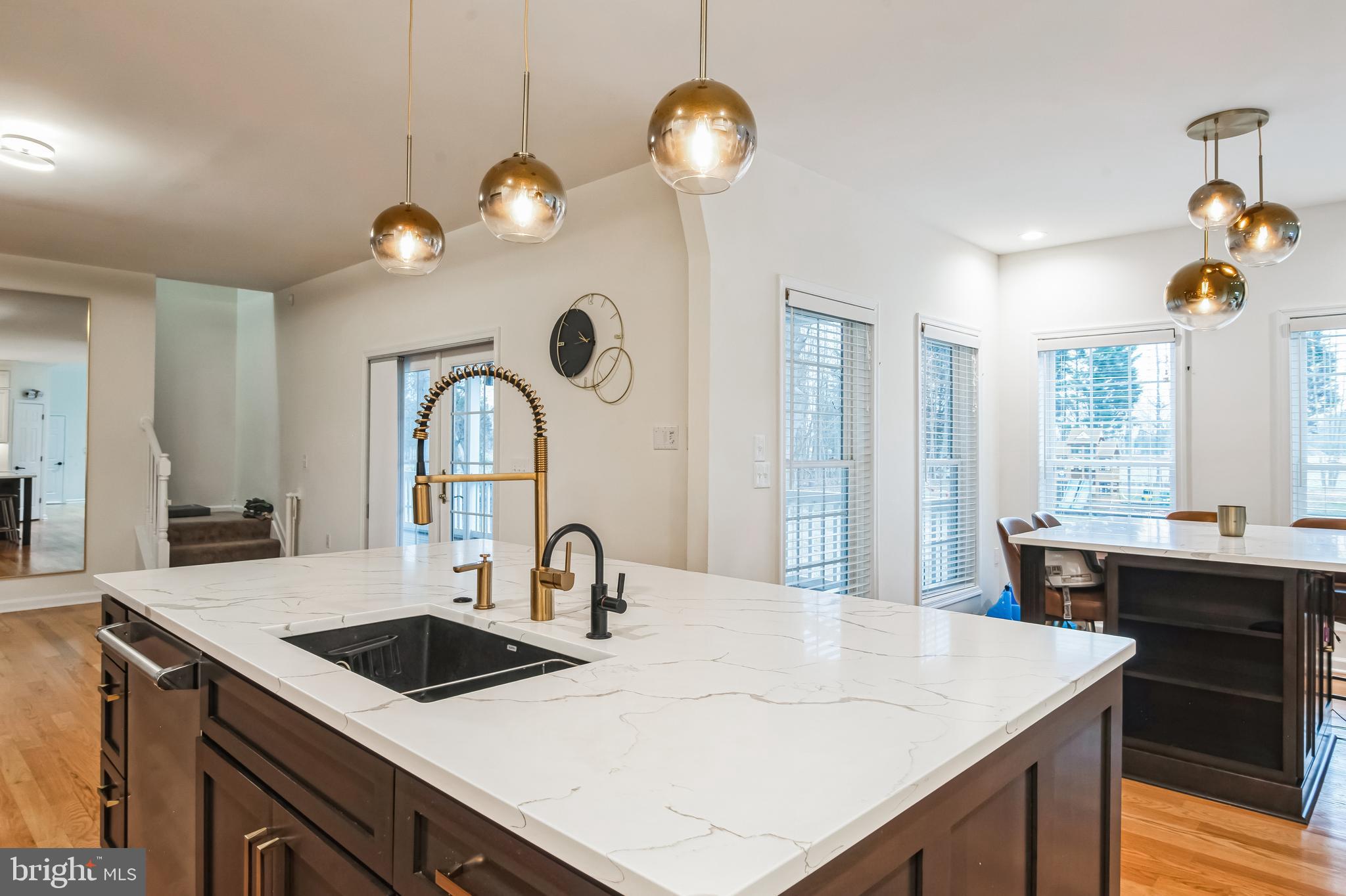 8419 Ingleton Road Easton, MD 21601 - Photo 18 of 58 a kitchen with a table chairs and a chandelier