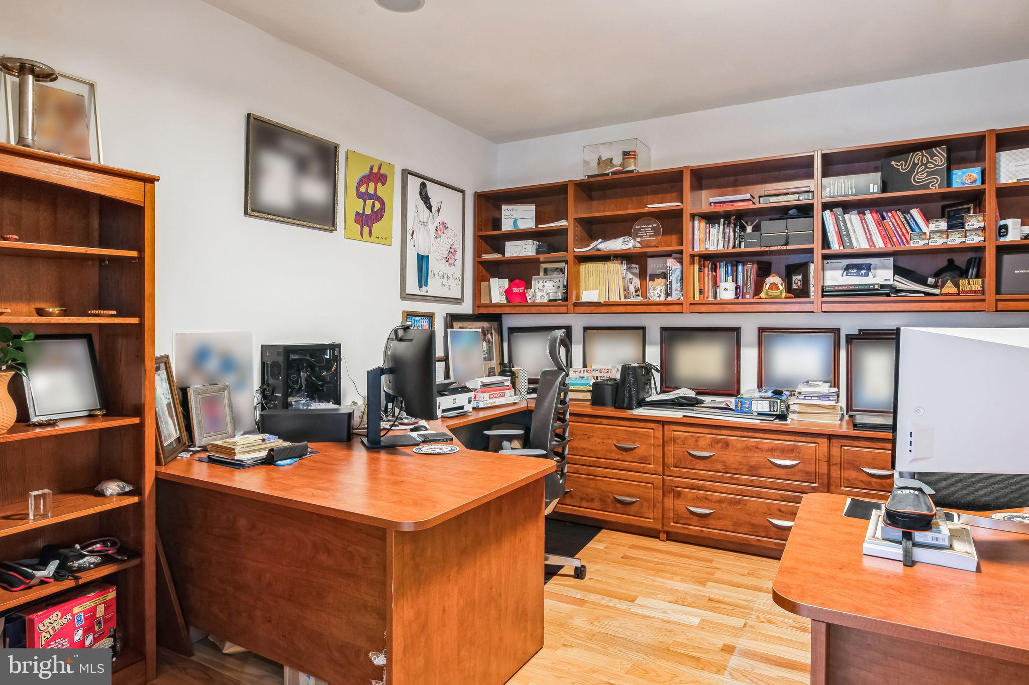8419 Ingleton Road Easton, MD 21601 - Photo 25 of 58 a living room with fireplace furniture and a book shelf
