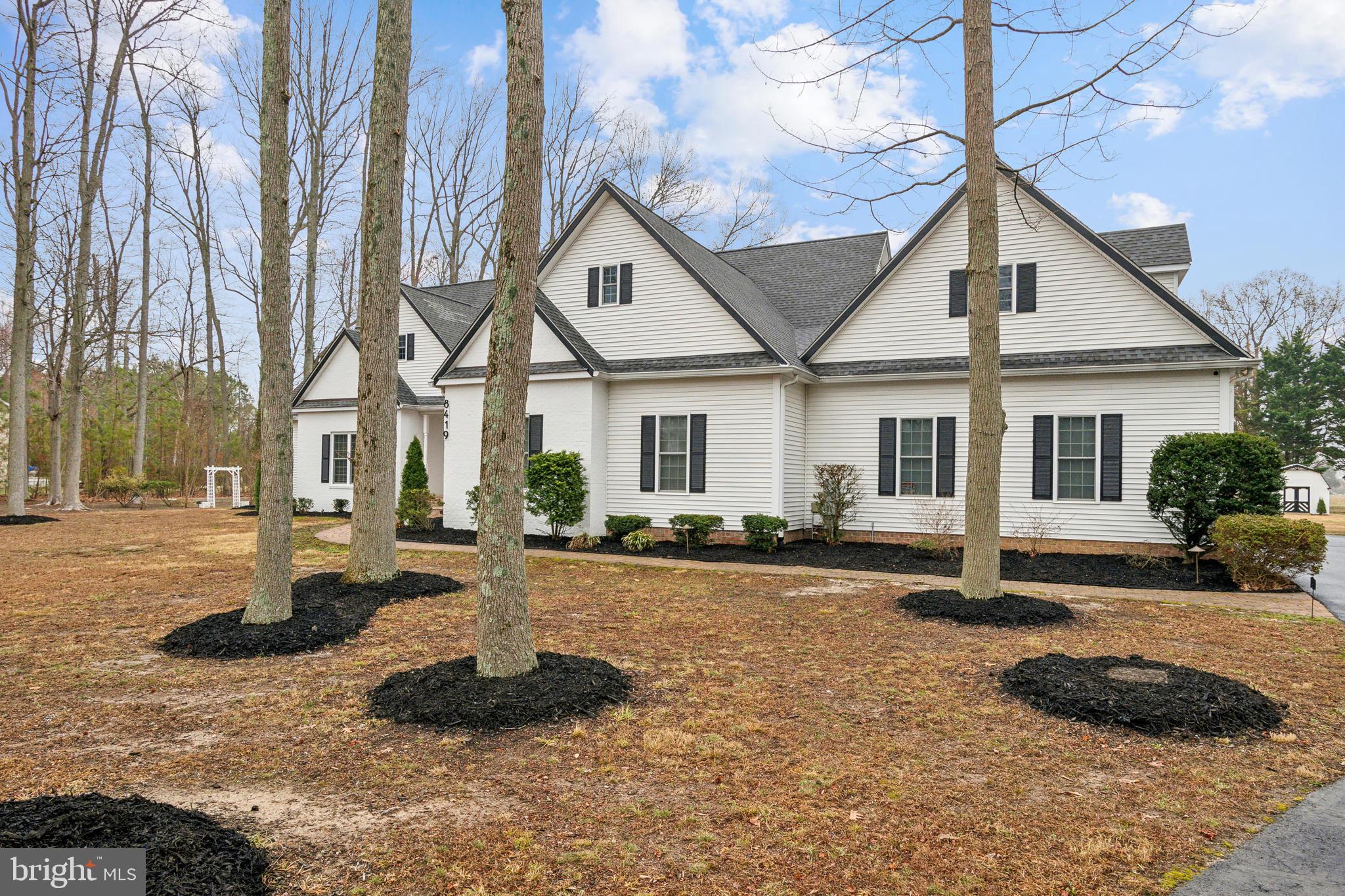 8419 Ingleton Road Easton, MD 21601 - Photo 3 of 58 a front view of a house with a yard