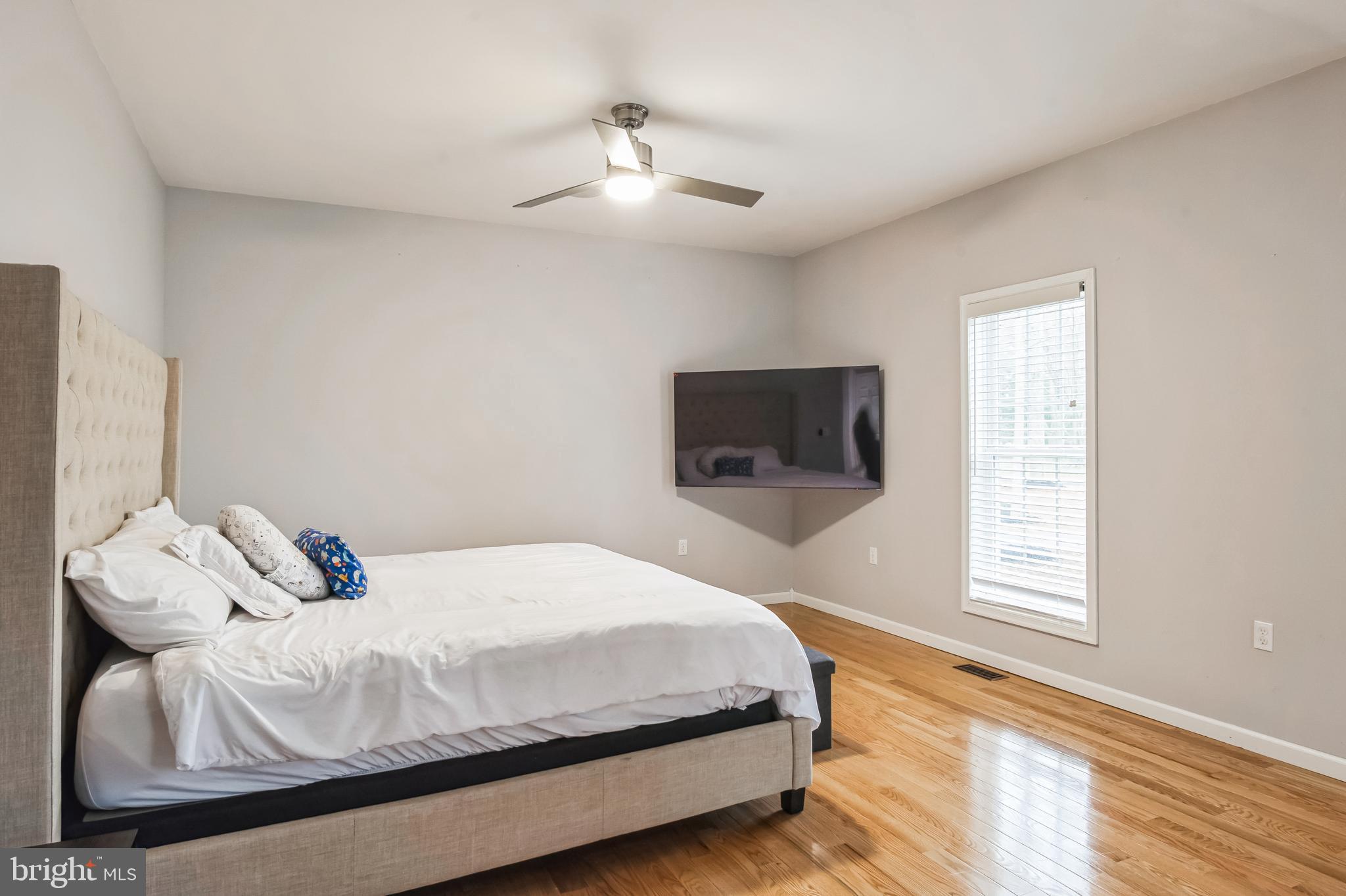 8419 Ingleton Road Easton, MD 21601 - Photo 31 of 58 a bedroom with a bed and a tv