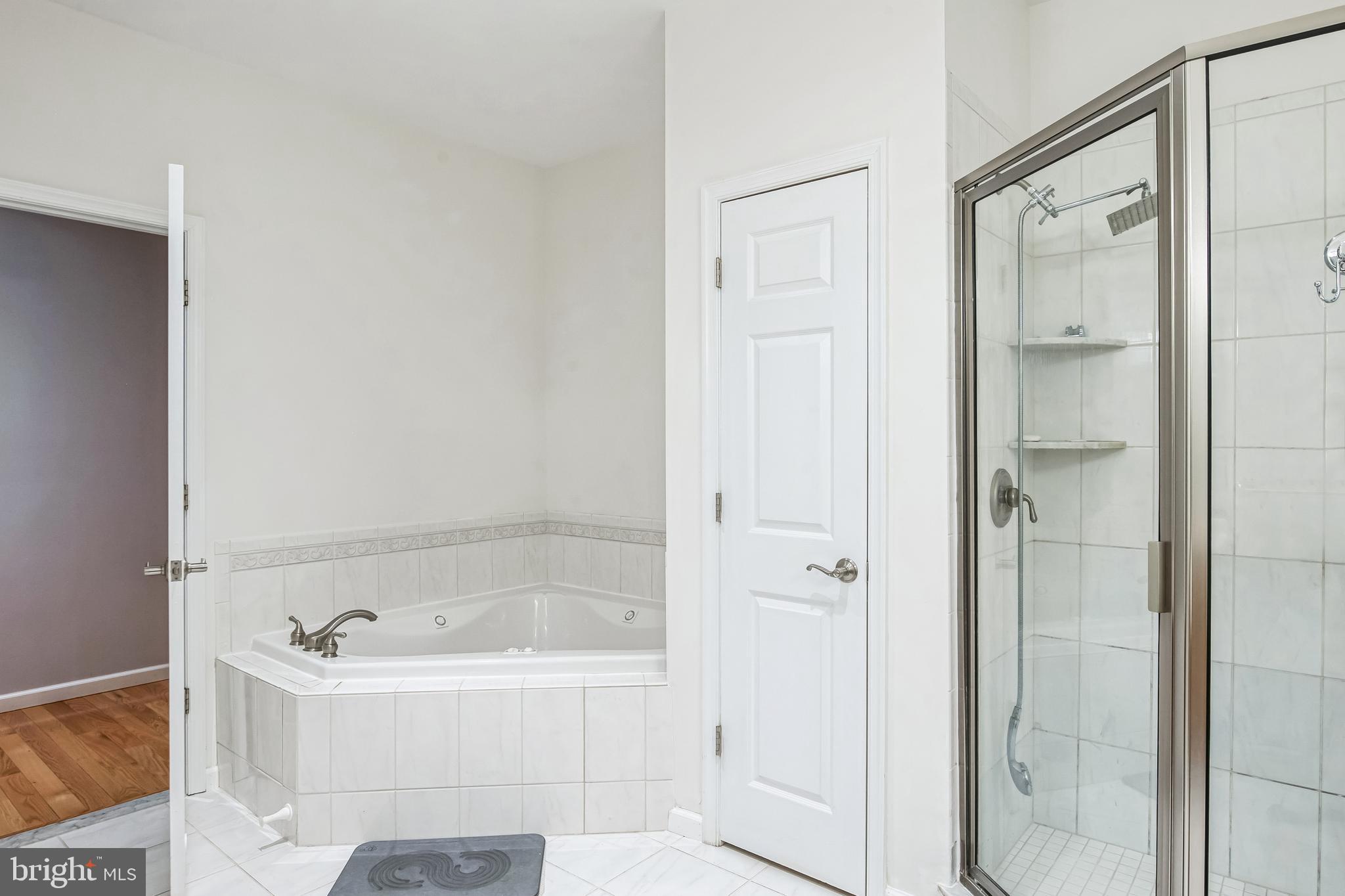 8419 Ingleton Road Easton, MD 21601 - Photo 36 of 58 a bathroom with a bathtub and shower
