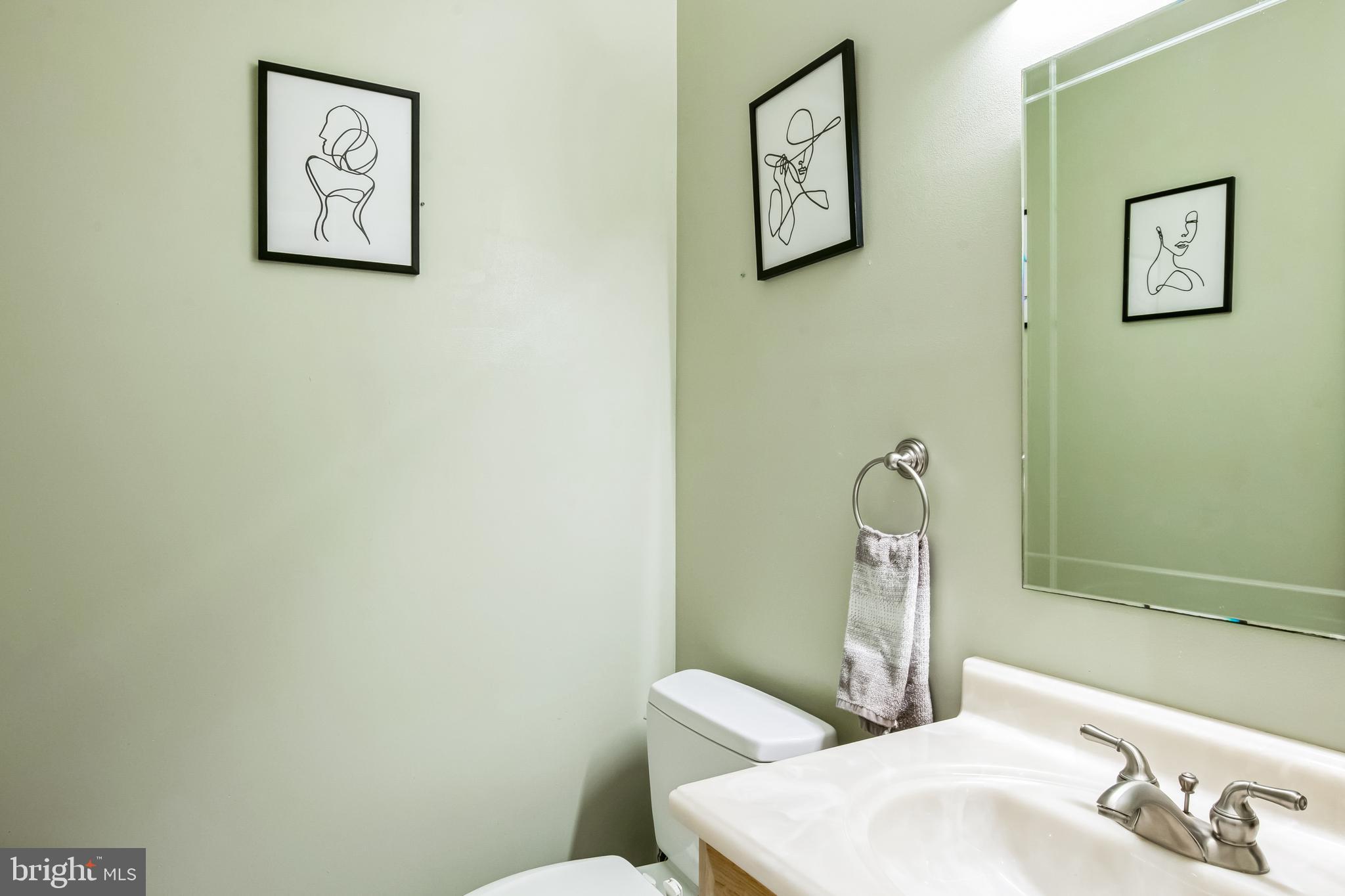 8419 Ingleton Road Easton, MD 21601 - Photo 40 of 58 a bathroom with a sink and a mirror