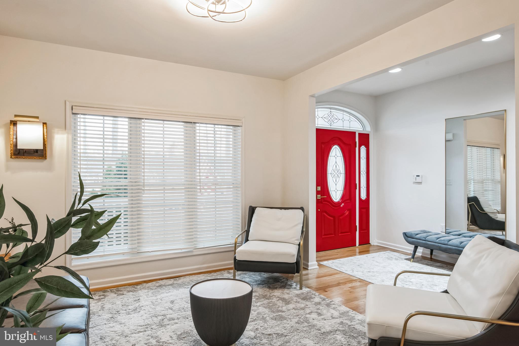 8419 Ingleton Road Easton, MD 21601 - Photo 8 of 58 a living room with furniture and a potted plant