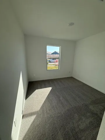 a view of a kitchen with a sink and cabinets