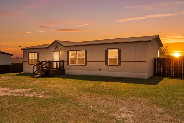 a front view of a house with yard