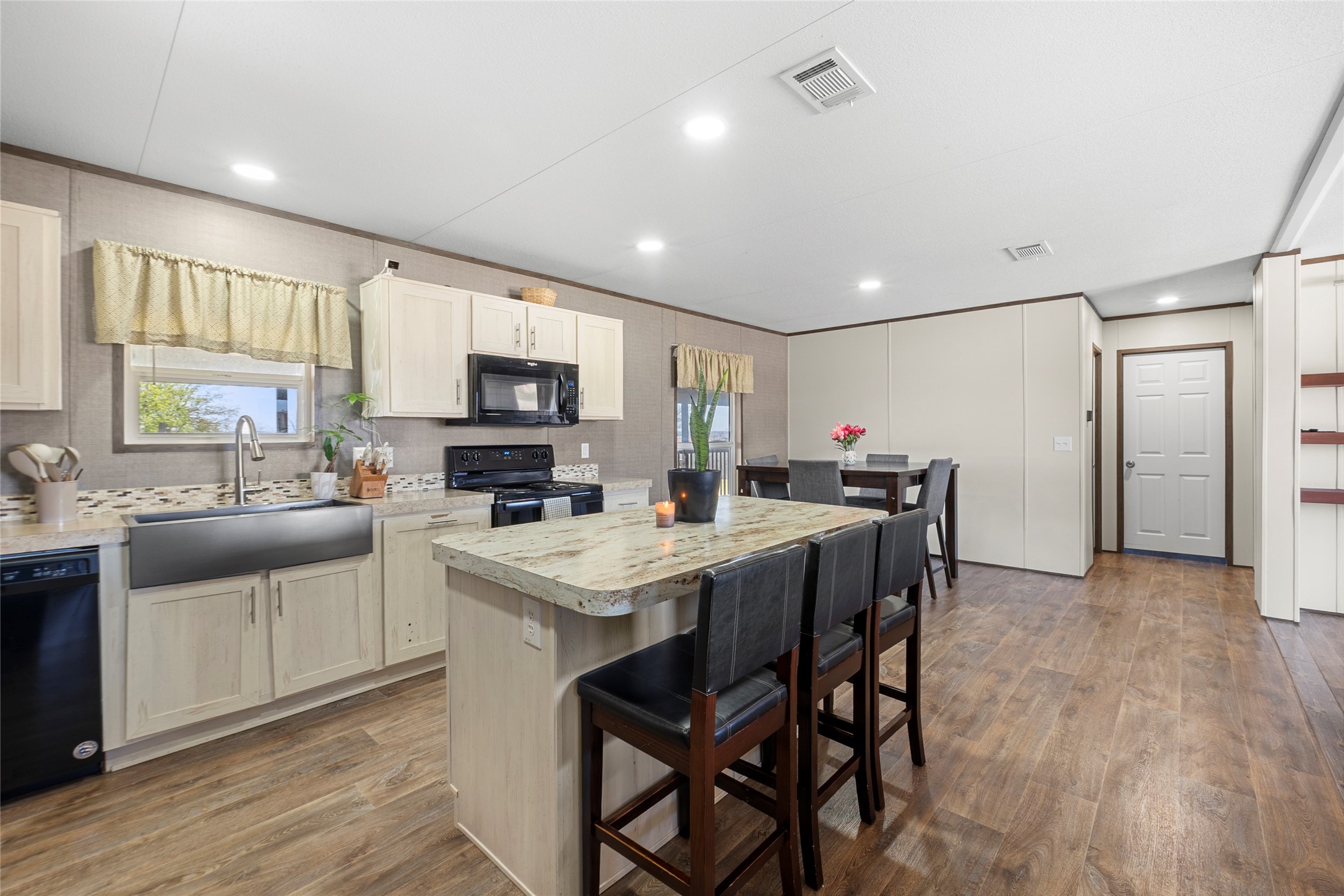 22774 Windy Mdws Cove Jarrell, TX 76537 - Photo 15 of 30 a kitchen with a table and chairs in it