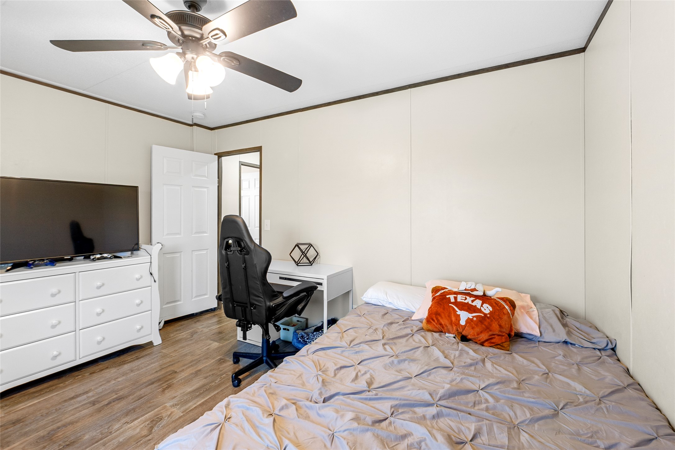 22774 Windy Mdws Cove Jarrell, TX 76537 - Photo 24 of 30 a bedroom with furniture and a flat screen tv