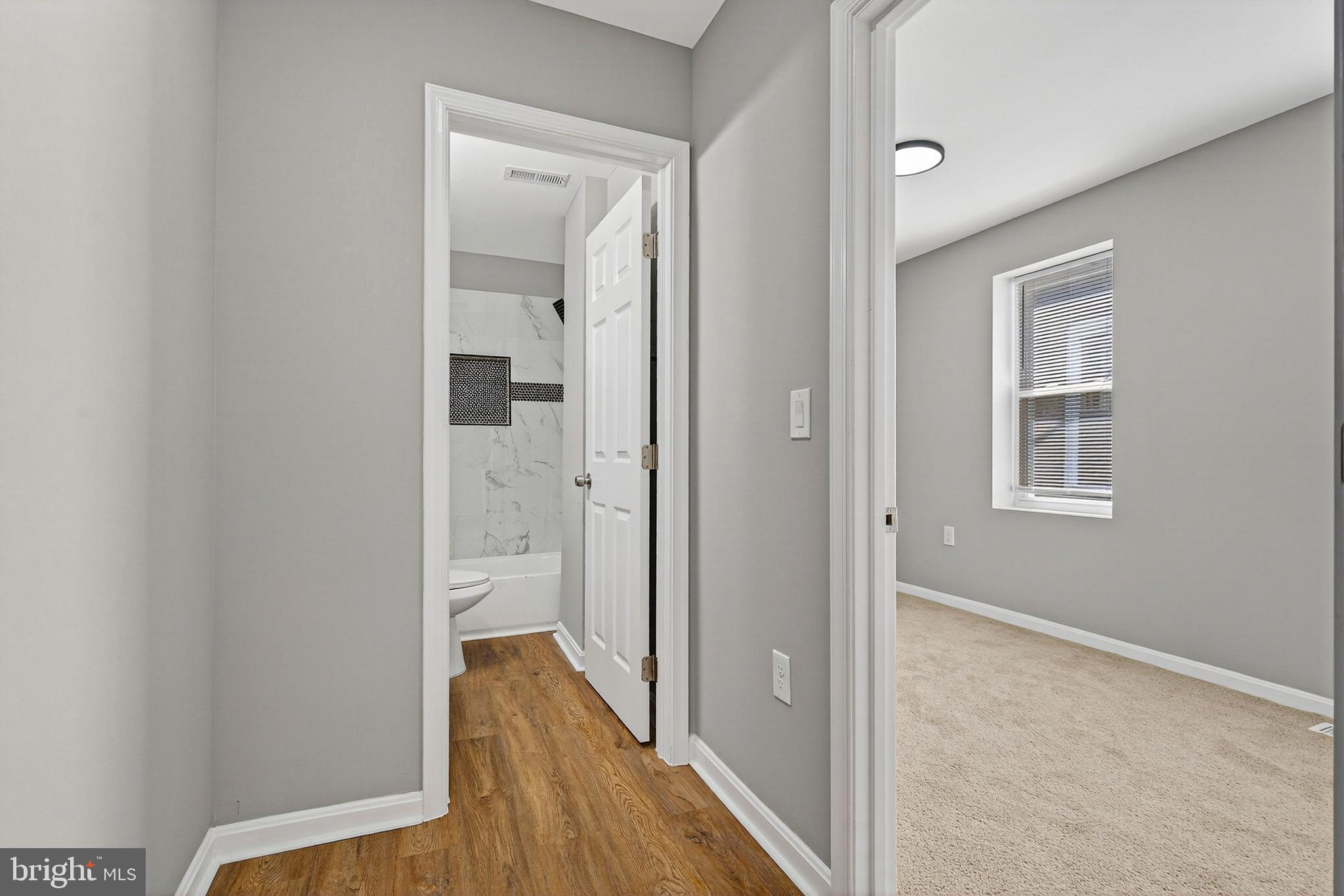 2001 North Fulton Avenue Baltimore, MD 21217 - Photo 19 of 28 a view of hallway with wooden floor
