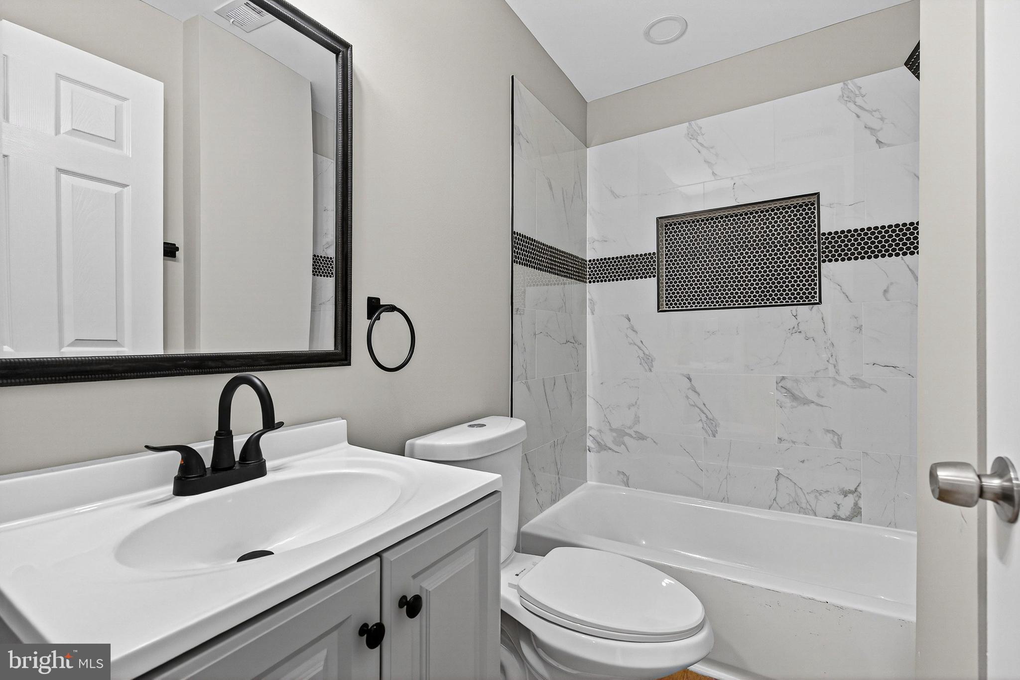 2001 North Fulton Avenue Baltimore, MD 21217 - Photo 20 of 28 a bathroom with a sink toilet and shower