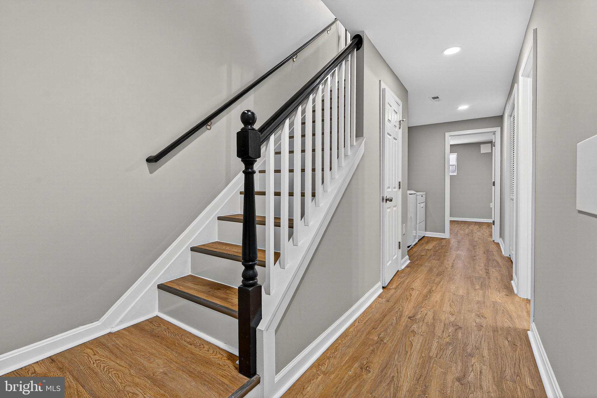 2001 North Fulton Avenue Baltimore, MD 21217 - Photo 22 of 28 a view of a hallway with wooden floor and staircase