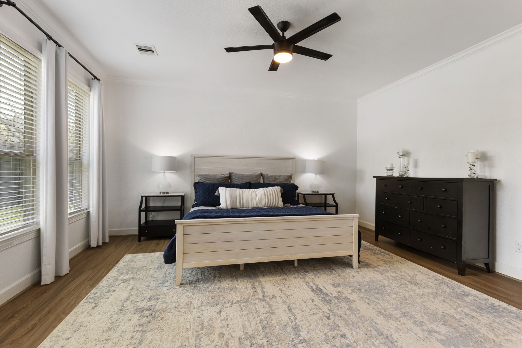 71 Sagamore Ridge Place The Woodlands, TX 77389 - Photo 20 of 34 a bedroom with a bed and a dresser