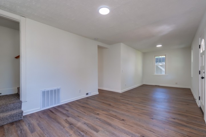 508 Dupont Avenue Madison, TN 37115 - Photo 2 of 22 an empty room with wooden floor and windows