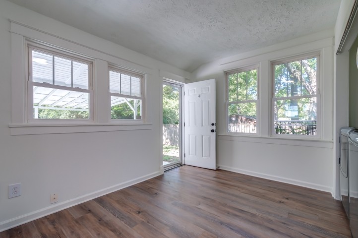 508 Dupont Avenue Madison, TN 37115 - Photo 11 of 22 a view of an empty room with wooden floor and a window