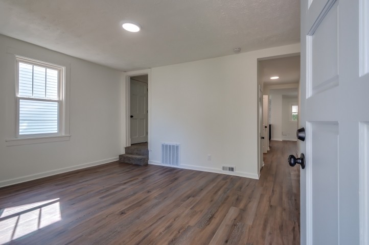 508 Dupont Avenue Madison, TN 37115 - Photo 3 of 22 an empty room with wooden floor and windows