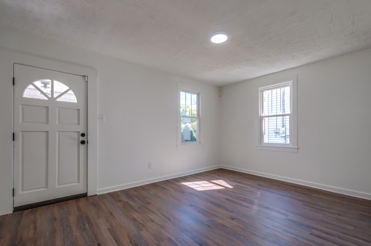 508 Dupont Avenue Madison, TN 37115 - Photo 4 of 22 an empty room with wooden floor and windows
