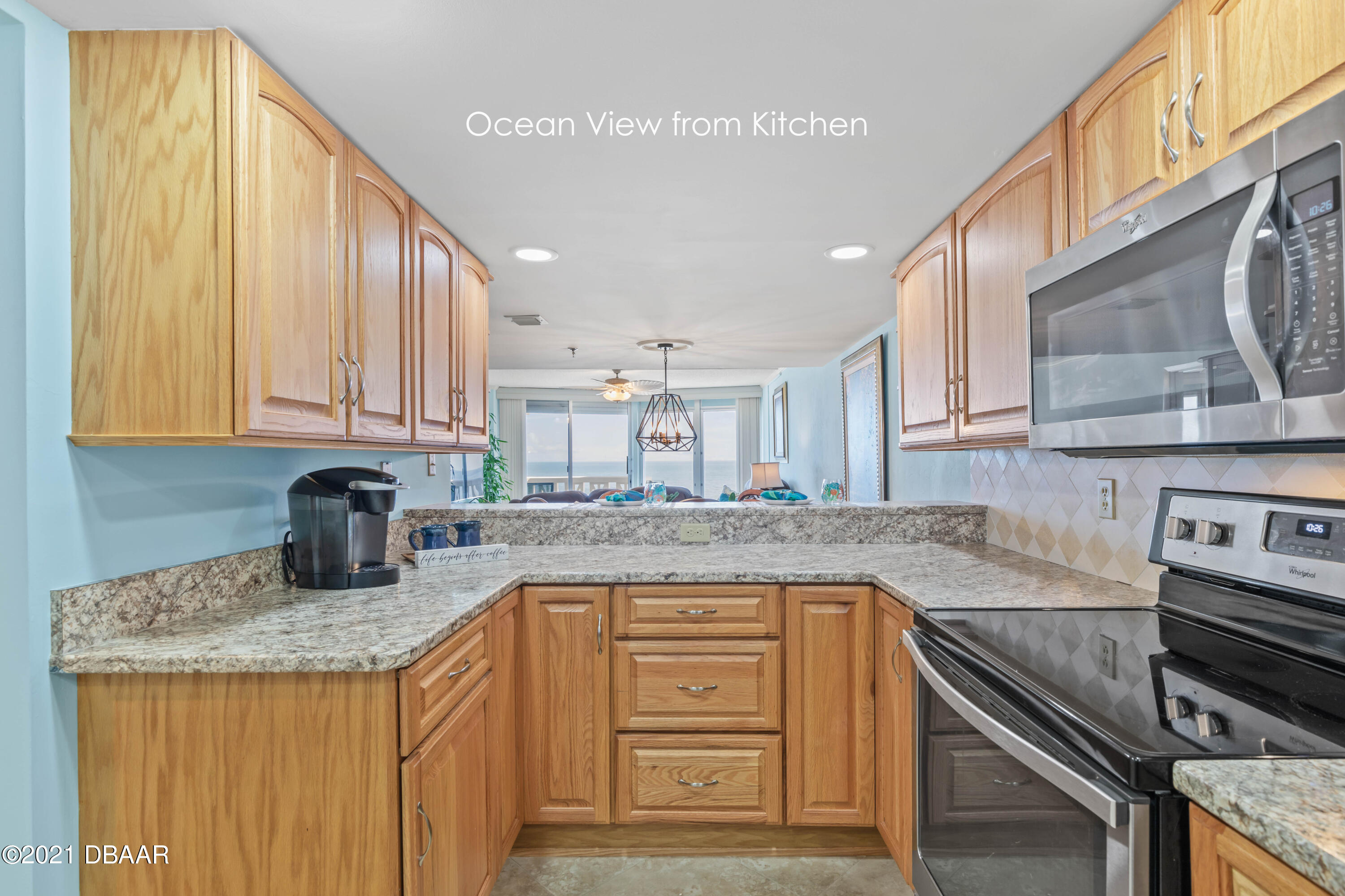 1051 Ocean Shore Boulevard, Unit 1202 Ormond Beach, FL 32176 - Photo 6 of 31 Kitchen w/ocean view
