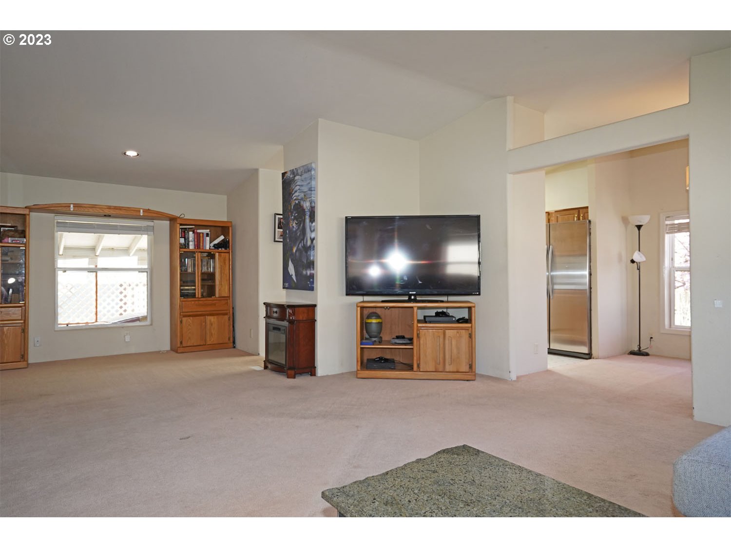 23077 Southwest Main Street, Unit 50 Sherwood, OR 97140 - Photo 12 of 24 a living room with furniture and a flat screen tv
