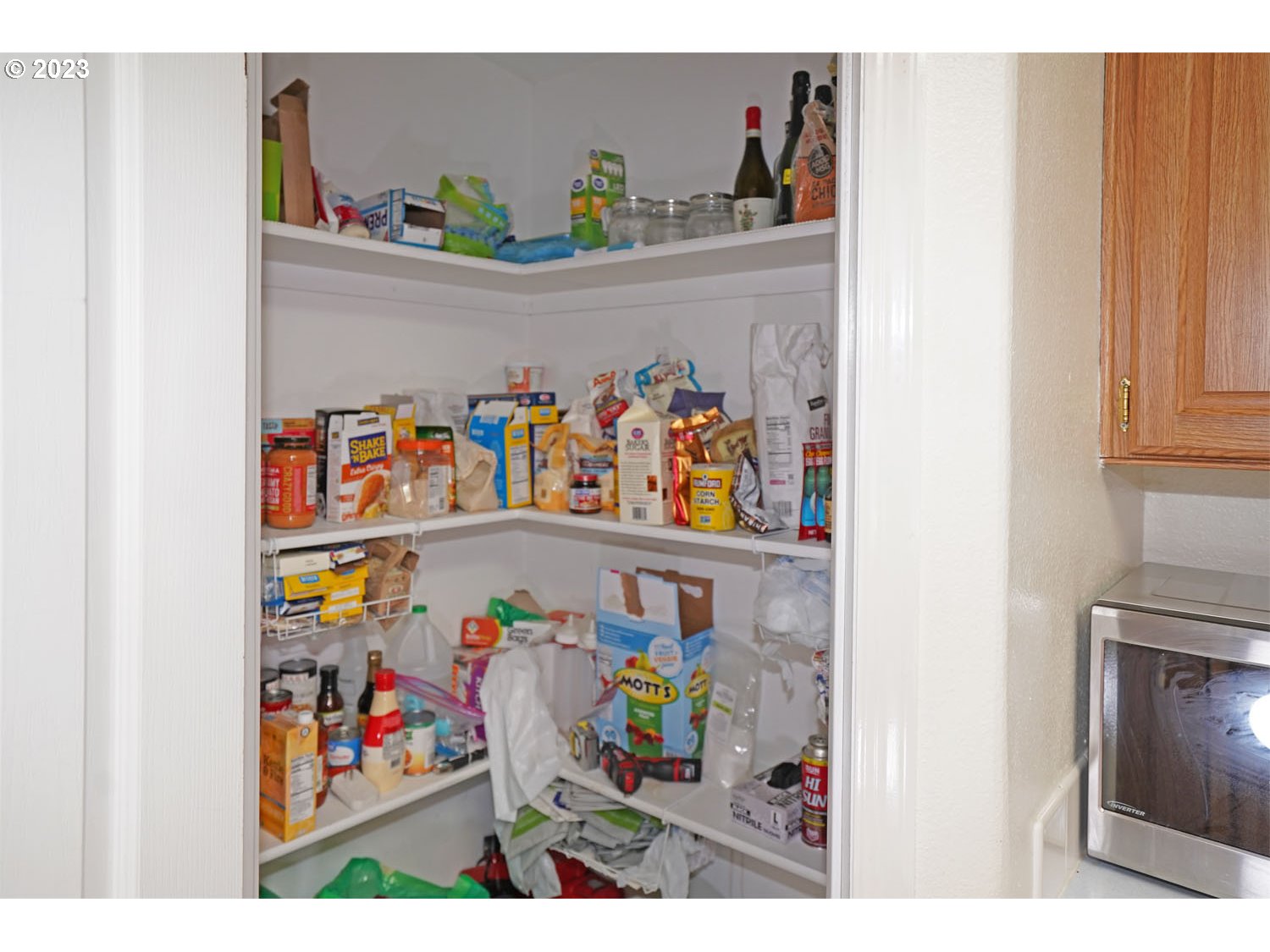 23077 Southwest Main Street, Unit 50 Sherwood, OR 97140 - Photo 19 of 24 a view of a refrigerator in a storage