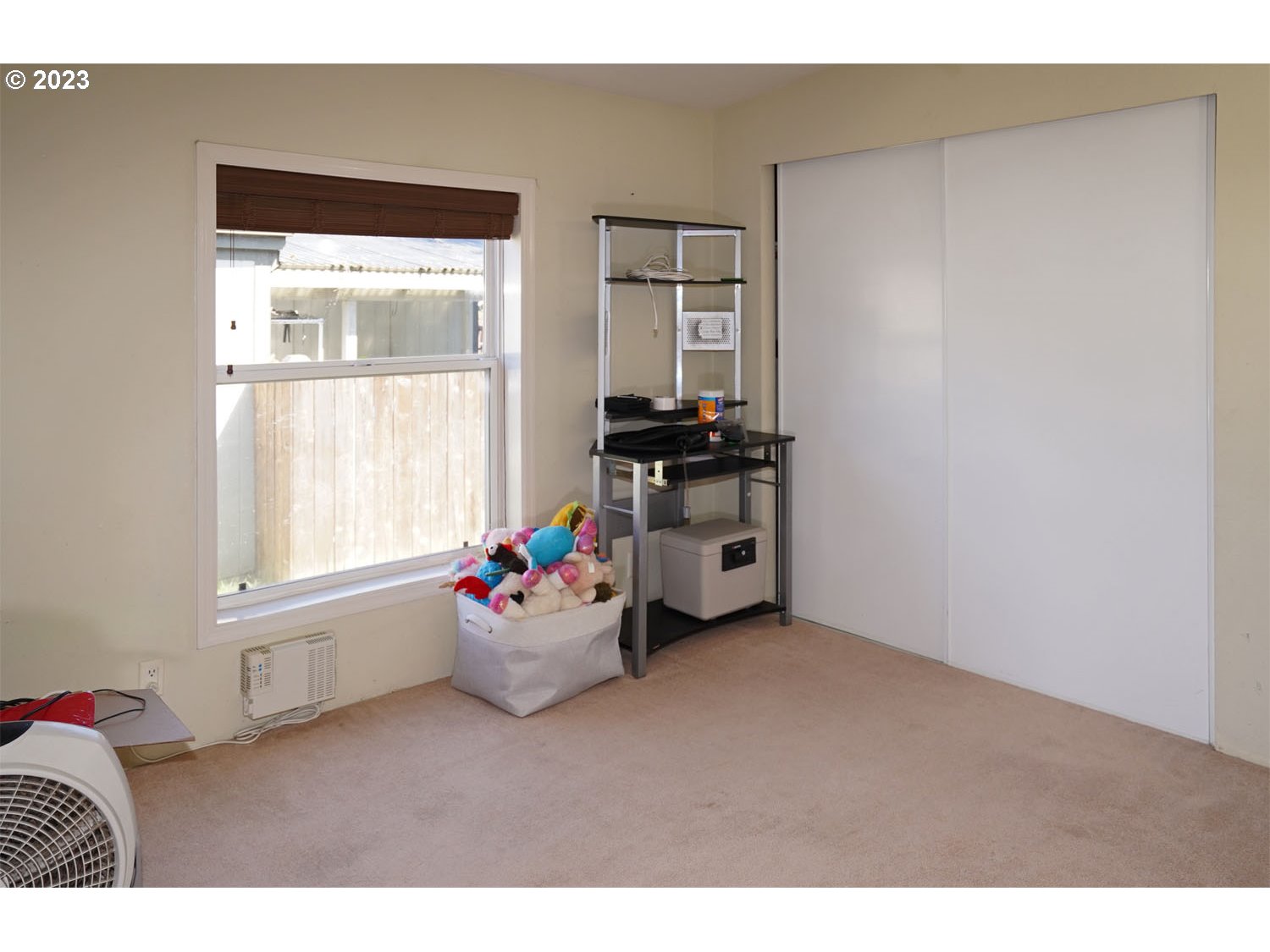 23077 Southwest Main Street, Unit 50 Sherwood, OR 97140 - Photo 22 of 24 a living room with furniture and a window