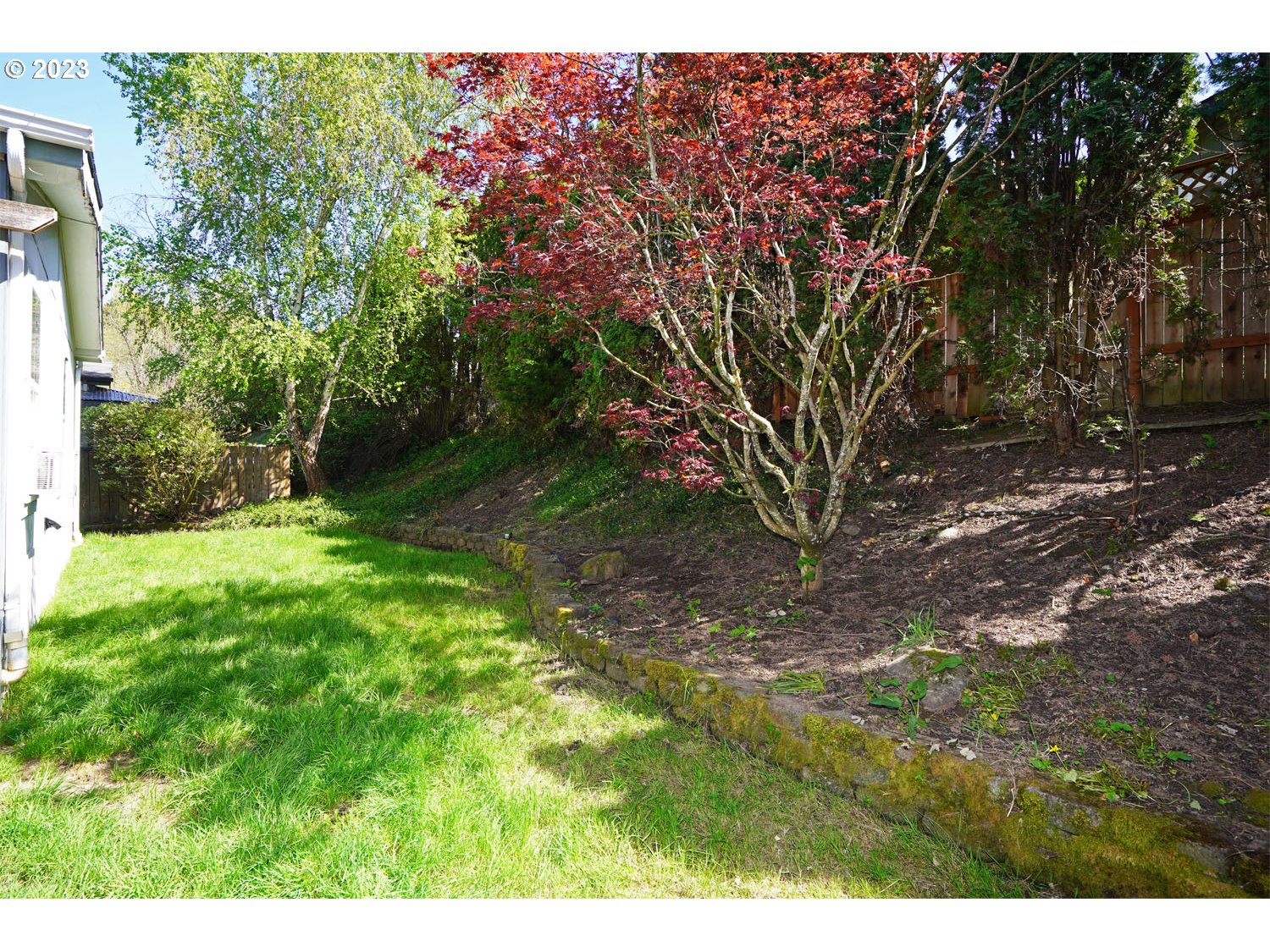 23077 Southwest Main Street, Unit 50 Sherwood, OR 97140 - Photo 7 of 24 a view of a backyard