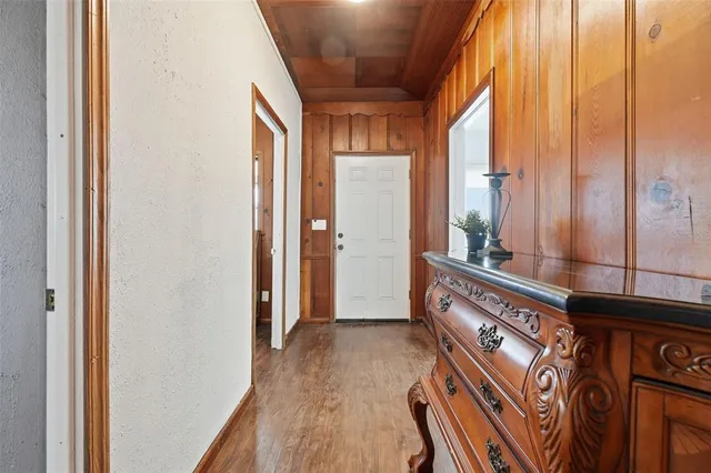 an aerial view of a house with a garden and swimming pool